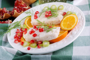 merluzzo all'arancia con chicchi di melagrana