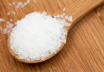 sea salt in wooden spoon