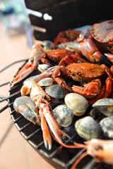 crabs shrimps on charcoal grill