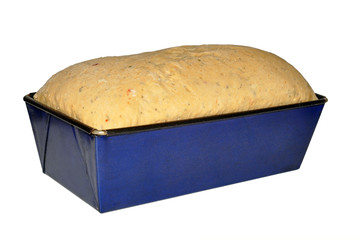 Bread Dough Rising In Baking Tin