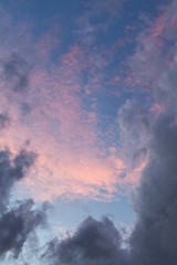 dark grey clouds on pink sunset