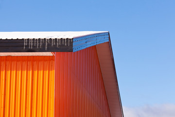 Orange metal sheet siding warehouse construction