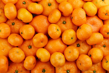 Many orange tangerines background