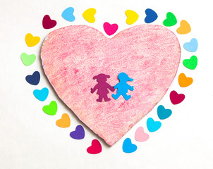 paper hearths with  a wooden pink heart and paper boy and girl