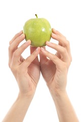 Hands of a woman with an apple