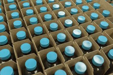 Medicine bottles in shipping container © Christian Delbert