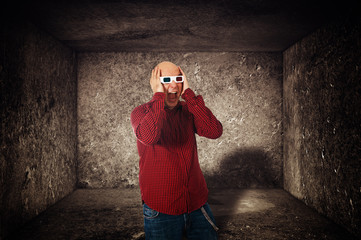 Scared man with 3d anaglyph glasses screaming