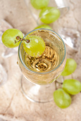 Clear drink with grapes, top view