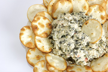 Artichoke and spinach dip with pita bread chips