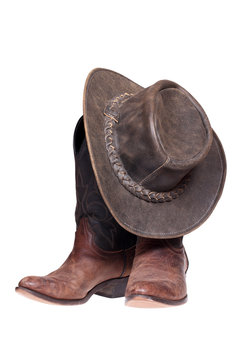 Leather cowboy boots and hat isolated  with clipping path.