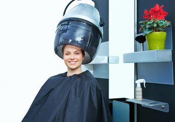 woman using hair dryer