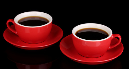 A red cups of strong coffee isolated on black