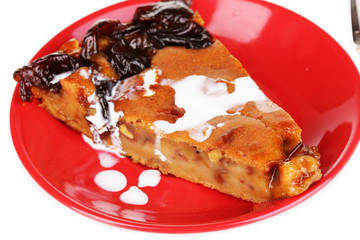 Tasty pie on red plate isolated on white