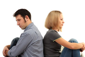 Young couple turning away from each other isolated on white