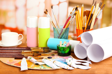Artistic equipment: paint, brushes and art palette