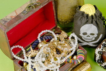 two small boxes with treasures on a light green background