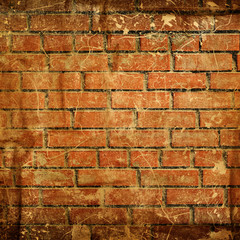 Red brick wall background with black and red stains