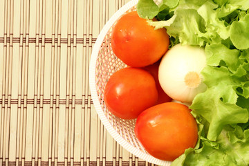 Fresh vegetable in a white basket