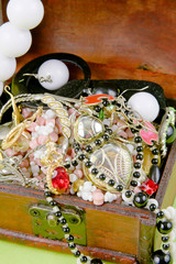 small box with treasures on a light green background