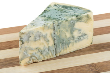 Wedge of soft blue cheese, isolated on white
