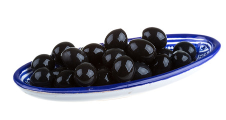 Olives black watered with olive oil in a bowl isolated on a whit