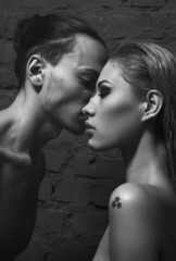 Hansome man kissing beautiful woman with passion topless