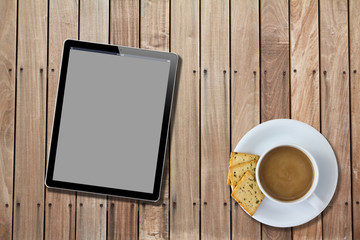 Fototapeta na wymiar Tablet computer Wood Table with hot coffee
