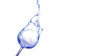 Pouring water into glass isolated on white (splash of water)