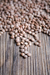 Lentils on a wooden background