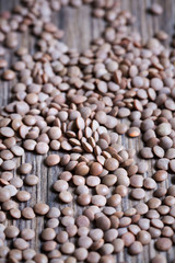 Lentils on a wooden background