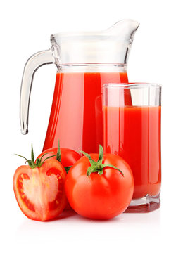 Jug and glass of tomato juice with fruits isolated