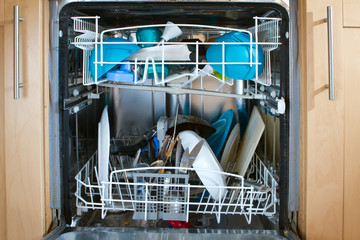 inside of as dishwasher containing dirty dishes