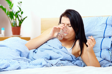 young woman feels thirsty in the morning