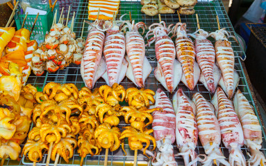Many of grilled squid ready for sale in street market