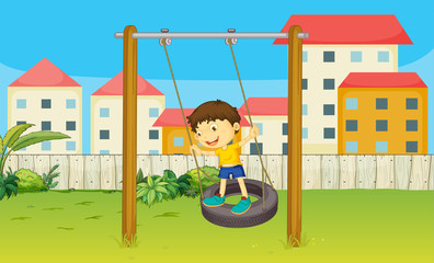 Boy playing swing