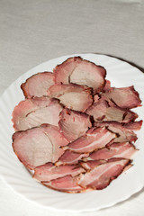 slices of the pickled ham, the neck and the bacon