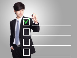business man checking on a checklist box