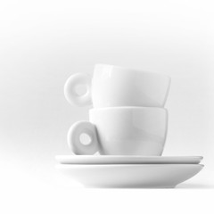 Double espresso metaphor with two small white cups