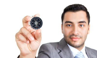 Business man holding compass, close-up isolated on white