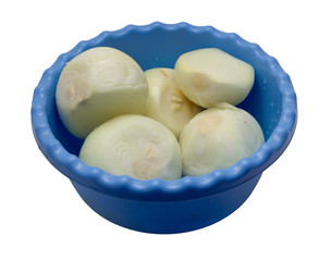 peeled onion in a dish on a white background