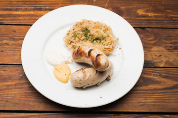 Sausages and old wooden table