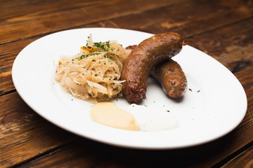 Sausages and old wooden table