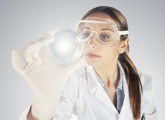 woman scientist analyzing Petri dishes in the laboratory