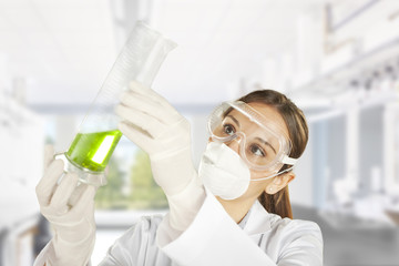 scientist woman in lab coat with chemical glassware