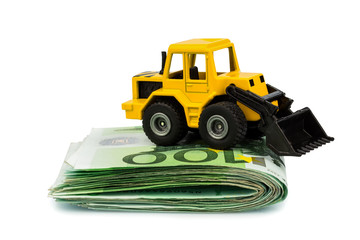 Bagger auf Euro-Banknoten