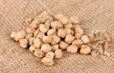 White chickpeas on sackcloth background