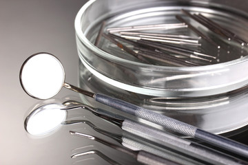 Set of dental tools for teeth care isolated on grey background