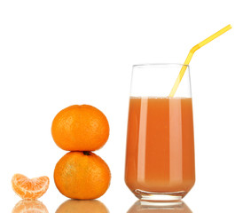 Delicious tangerine juice in glass and mandarins next to it