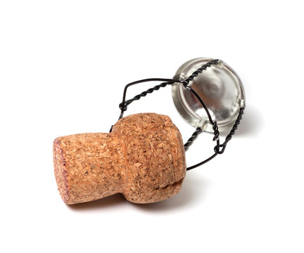 Champagne wine cork and muselet on white background