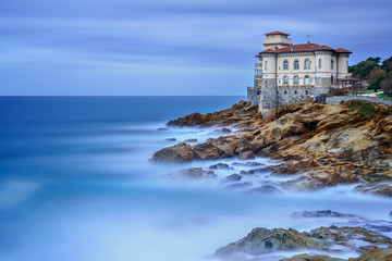 Boccale castle landmark on cliff rock and sea. Tuscany, Italy.